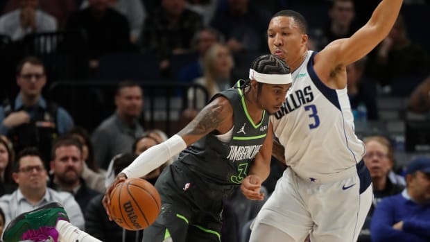 Minnesota Timberwolves forward Jaden McDaniels (3) works around Dallas Mavericks forward Grant Williams (3) in the first quarter at Target Center in Minneapolis on Jan. 31, 2024.